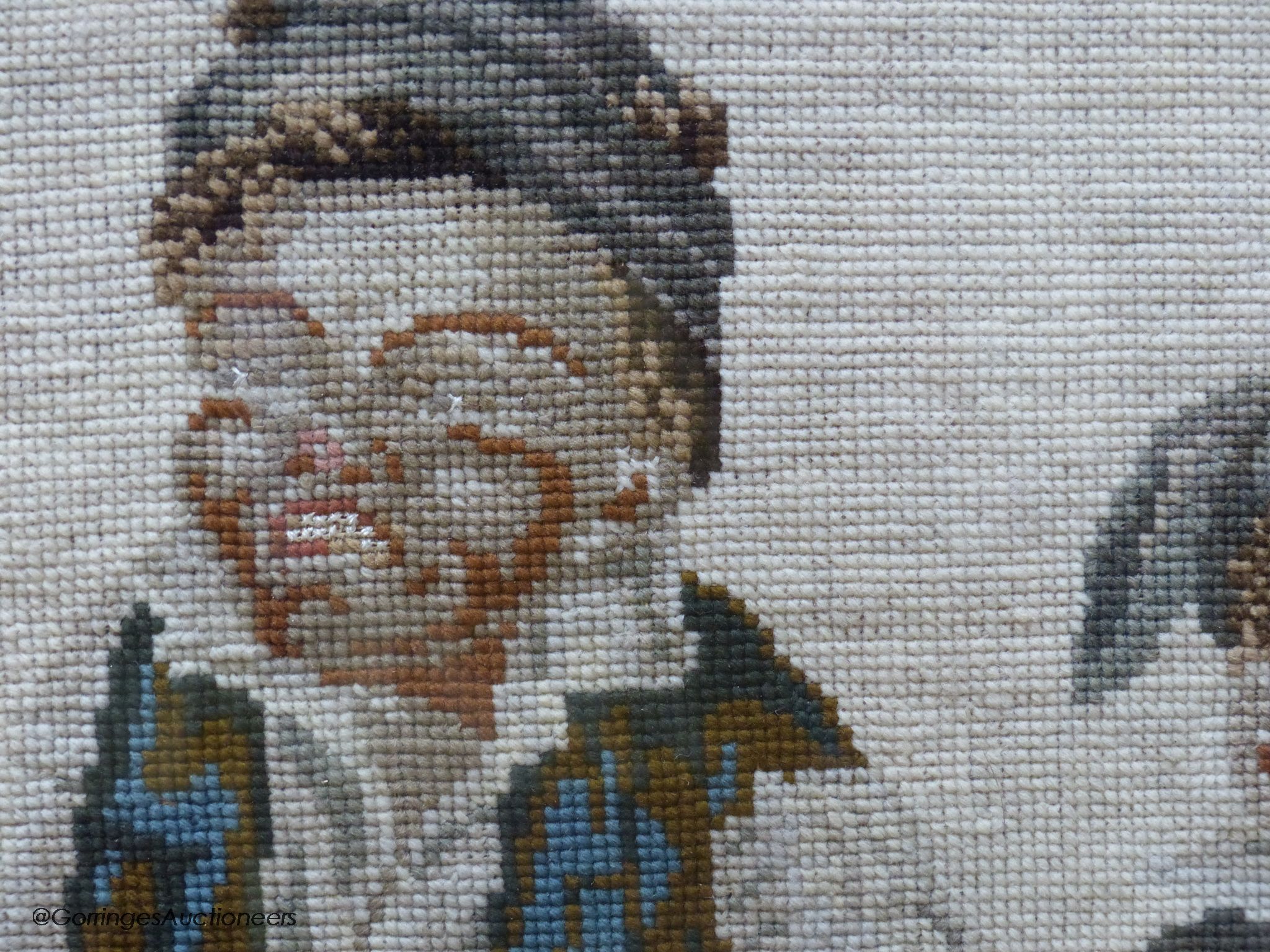 A Victoian petit-point needlework picture, two playful youths